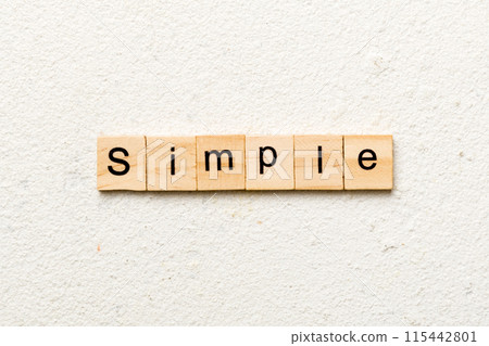 simple word written on wood block. simple text on table, concept simple word written on wood block. simple text on table, concept 115442801
