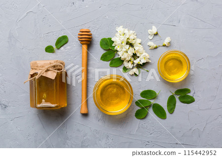 honey jar with acacia flowers and leaves. fresh honey top view flat lay 115442952