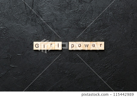 Girl Power word written on wood block. Girl Power text on cement table for your desing, concept Girl Power word written on wood block. Girl Power text on cement table for your desing, concept 115442989