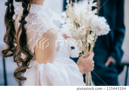 A bride with a bouquet A bride with a bouquet 115443104