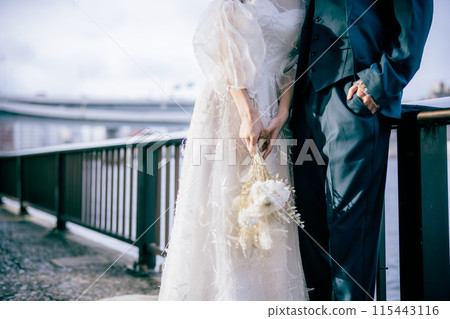 Wedding couple's hands 115443116