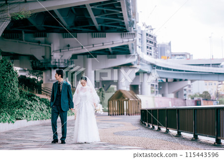 Couple taking location photo wedding photos 115443596