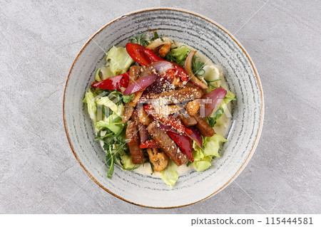 Beef steak salad with cherry tomatoes, cucumbers, red onions, romaine salad and lime mustard olive oil salad dressing Beef steak salad with cherry tomatoes, cucumbers, red onions, romaine salad and lime mustard olive oil salad dressing 115444581