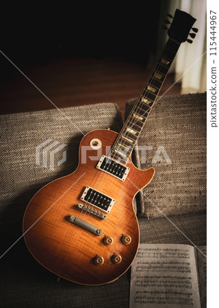 Guitar on the sofa 115444967
