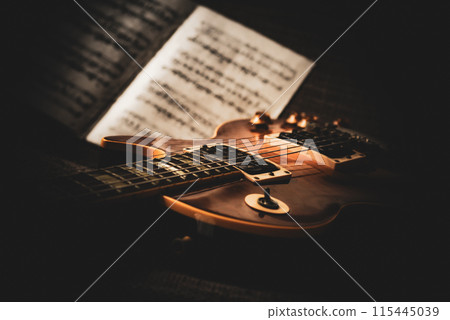 Sheet music and electric guitar 115445039