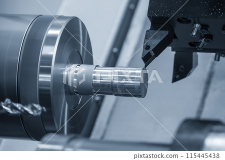 The  CNC lathe machine forming  cutting the metal shaft parts. 115445438