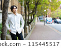 Young business man walking down the street 115445517
