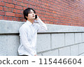 A businessman talking on a smartphone 115446604