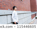 Woman climbing brick stairs 115446605