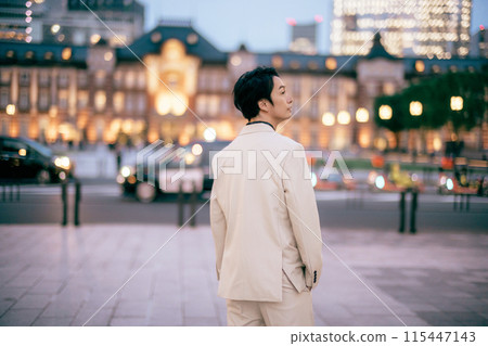Groom posing in front of Tokyo Station 115447143