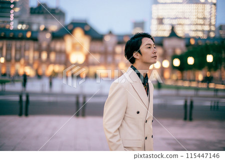 Groom posing in front of Tokyo Station 115447146