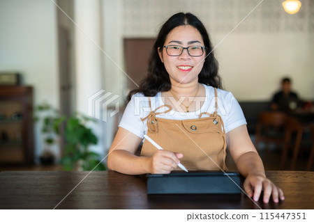 Portrait asian freelance people business female wearing glasses stylish hipste Draw or taking note on digital tablet with electronic pen for browsing internet, chatting and blogging in coffee shop. Portrait asian freelance people business female wearing glasses stylish hipste Draw or taking note on digital tablet with electronic pen for browsing internet, chatting and blogging in coffee shop. 115447351