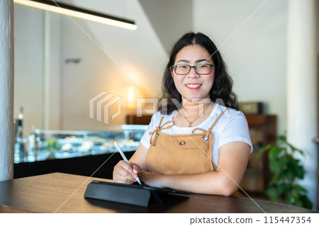 Portrait asian freelance people business female wearing glasses stylish hipste Draw or taking note on digital tablet with electronic pen for browsing internet, chatting and blogging in coffee shop. Portrait asian freelance people business female wearing glasses stylish hipste Draw or taking note on digital tablet with electronic pen for browsing internet, chatting and blogging in coffee shop. 115447354