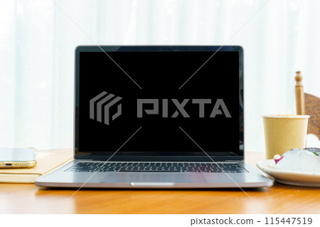 Mockup of laptop computer with empty screen with notebook,Hot coffee in cup made of paper and Blueberry Cake and smartphone on table side the window in the coffee shop at the cafe,Black screen Mockup of laptop computer with empty screen with notebook,Hot coffee in cup made of paper and Blueberry Cake and smartphone on table side the window in the coffee shop at the cafe,Black screen 115447519