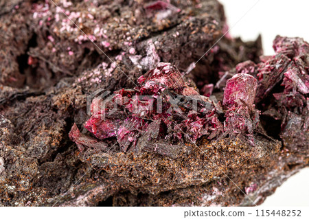 Macro stone Erythrite mineral on white background 115448252