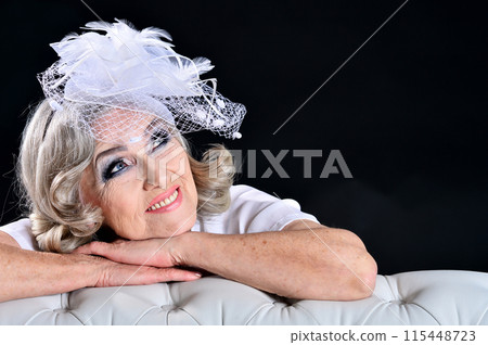 Portrait of happy senior woman posing at home 115448723