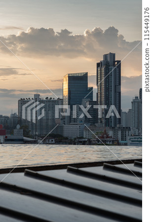 View of Skyscrapers and Dramatic Sky before Sunset. 115449176
