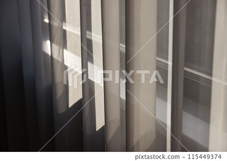 Window curtain detail with sunlight Window curtain detail with sunlight 115449374