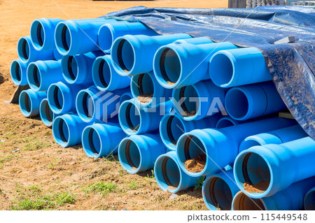 Blue PVC pipes are visible on construction site for laying pipe water system for new house 115449548