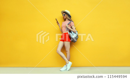 Summer vacation, tourism, happy traveler young woman tourist holding phone in hat with backpack Summer vacation, tourism, happy traveler young woman tourist holding phone in hat with backpack 115449594