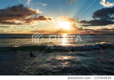 Sunset over ocean with boat in the distance on a beautiful evening Sunset over ocean with boat in the distance on a beautiful evening 115449836