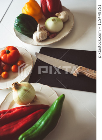 Vegetable ingredients in the kitchen Vegetable ingredients in the kitchen 115449851