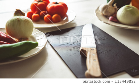 Vegetable ingredients in the kitchen Vegetable ingredients in the kitchen 115449852