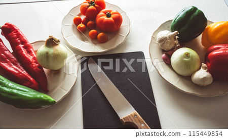 Vegetable ingredients in the kitchen Vegetable ingredients in the kitchen 115449854