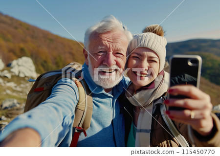 Senior tourist couple hiking and taking selfie at the beautiful mountains. Generative AI 115450770
