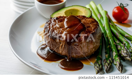 A plate of a steak with sauce and asparagus on it, AI 115451014