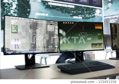 Military operations command center surveillance gear following global threats on a big screen, empty intelligence agency headquarters works on international safety alerts. National guard division. Military operations command center surveillance gear following global threats on a big screen, empty intelligence agency headquarters works on international safety alerts. National guard division. 115451159