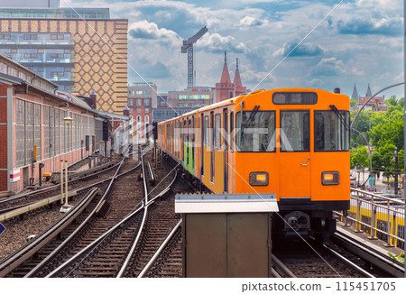 Yellow carriages of the famous Berlin metro on a sunny day. 115451705