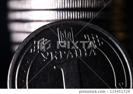 Coin one hryvnia, macro photography, Ukrainian money Coin one hryvnia, macro photography, Ukrainian money 115451729