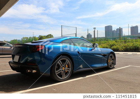 Image of a sports car in a parking lot Image of a sports car in a parking lot 115451815