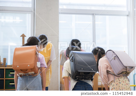 Elementary school student saying goodbye to teacher (no face) 115452948