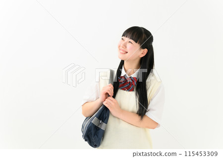 A high school girl in summer clothes holding a bag 115453309