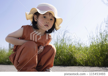 Cute girl staring intently 115453493