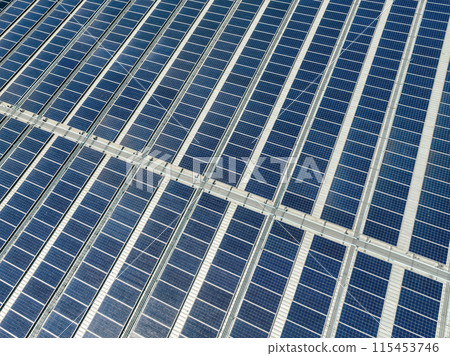 Solar panels on roof of industrial plant. Solar energy for factory or warehouse building. Commercial solar. Industrial photovoltaic panels. Rooftop solar power. Green energy. Sustainable energy. Solar panels on roof of industrial plant. Solar energy for factory or warehouse building. Commercial solar. Industrial photovoltaic panels. Rooftop solar power. Green energy. Sustainable energy. 115453746