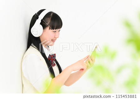 High school girl listening to music, headphones 115453881