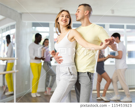Couple young woman and man dancing waltz Couple young woman and man dancing waltz 115453923