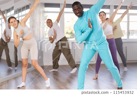 African American man practicing hip-hop during group dance class 115453932
