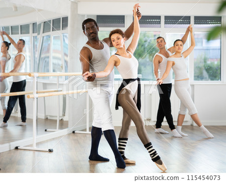 Adult man and adult woman rehearsing pair ballet Adult man and adult woman rehearsing pair ballet 115454073
