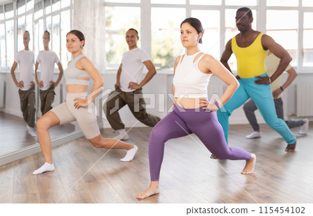 Young Asian woman stretching before training in dance class 115454102