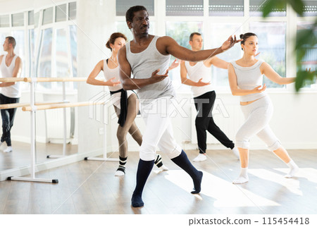 Group of dancers rehearsing ballet dance Group of dancers rehearsing ballet dance 115454418