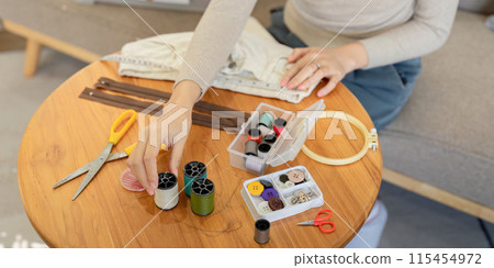 Volunteer Repair Clothes for Donation and Recycle, Promoting Sustainable Fashion and Community Support 115454972