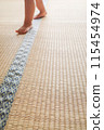 Children's feet on tatami mat and background 115454974