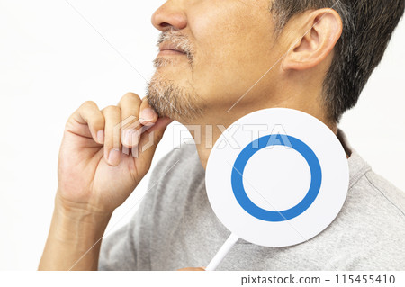 A bearded man holding a round plate on a white background A bearded man holding a round plate on a white background 115455410