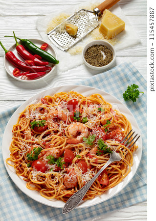 shrimp fra diavolo with spaghetti on a plate shrimp fra diavolo with spaghetti on a plate 115457887