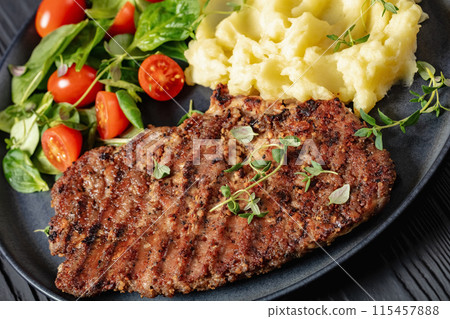 grilled pork steak with mashed potato and salad 115457888