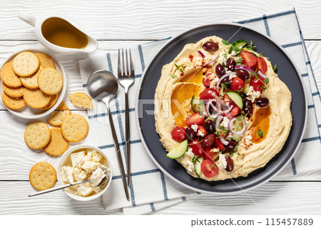Greek hummus with veggies, olives, feta on plate Greek hummus with veggies, olives, feta on plate 115457889